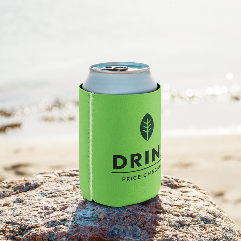 A lime can cooler with the Drina leaf and name, on a can at the beach
